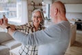 Cheerful senior couple dancing together at home. Royalty Free Stock Photo