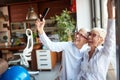 Cheerful senior female colleagues taking a selfie while having fun on the break at workplace. Business, office, job Royalty Free Stock Photo