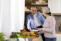 Cheerful Senior Husband And Wife Cooking Healthy Lunch In Kitchen Together Royalty Free Stock Photo