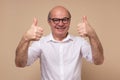 Cheerful senior man giving thumb up approving your choice Royalty Free Stock Photo
