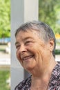 beautiful senior woman chatting with friends, laughing outdoors, enjoying on walk outdoors in summer Royalty Free Stock Photo