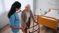 cheerful senior woman stepping with walkers