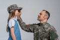 cheerful serviceman in army uniform wearing