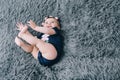 Cheerful seven months old baby laughing and playing on her bed Royalty Free Stock Photo