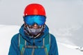 Cheerful skier looking at camera before starting to skiing. Happy man enjoying holiday in winter season. Smiling