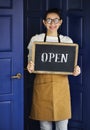 A cheerful small business owner with open sign Royalty Free Stock Photo