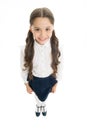 Cheerful smile. Girl cute pupil on white background. School uniform. Back to school. Student little kid adores school Royalty Free Stock Photo