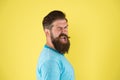 Cheerful smile. Man bearded hipster with mustache. Beard mustache grooming guide. Hipster handsome bearded guy yellow Royalty Free Stock Photo