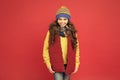 Cheerful smiling hipster child long hair in stylish outfit. Beautiful child. Winter ideas for fun. Fashion shop. Winter