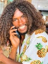 Cheerful smiling Sinhalese young man portrait calling to somebody using a smartphone. Natural people or communication technology