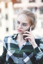 Cheerful smiling young girl smiling and talking on phone Royalty Free Stock Photo