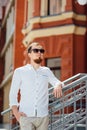 Cheerful smiling young male model in white shirt Royalty Free Stock Photo