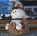 Cheerful snowman with broom