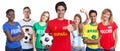 Cheerful spanish soccer fan with cheering group of other fans Royalty Free Stock Photo