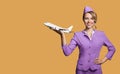 stewardess holding airplane in hand