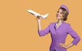 stewardess holding airplane in hand