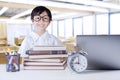 Cheerful student with science books in class Royalty Free Stock Photo