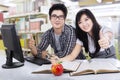 Cheerful students showing thumbs-up 3 Royalty Free Stock Photo