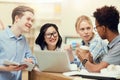 Cheerful students talking in library Royalty Free Stock Photo