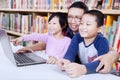 Cheerful students with teacher in the library Royalty Free Stock Photo