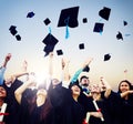 Cheerful Students Throwing Graduation Caps In The Air Royalty Free Stock Photo
