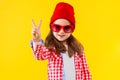 Colorful casual child girl isolated on yellow background Royalty Free Stock Photo