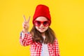 Colorful casual child girl isolated on yellow background Royalty Free Stock Photo