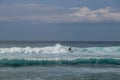 Cheerful Surfer Riding Big Foaming Ocean Wave in Sunny Nature. Man surfing on a cool surfboard in the summer sun near the idyllic Royalty Free Stock Photo