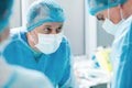 Cheerful surgical team is working in operating theatre Royalty Free Stock Photo