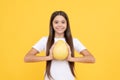 cheerful teen girl hold big citrus fruit of yellow pomelo full of vitamin, diet