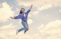 cheerful teen girl jumping high. kid jump outdoor. kid fashion and beauty. sense of freedom. portrait of energetic child