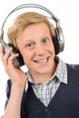 Cheerful teenage boy listening to music