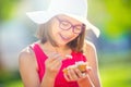 Cheerful teenage girl with dental braces glasses and ice cream. Portrait of a smiling pretty young girl in summer outfit with ice Royalty Free Stock Photo