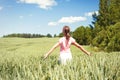 Cheerful teenage girl her face upward with opened outstretched a Royalty Free Stock Photo