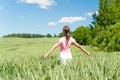 Cheerful teenage girl her face upward with opened outstretched a Royalty Free Stock Photo