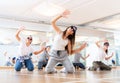 Teens hip hop dancers posing on knees