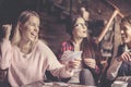 Three girls at home playing cards. Royalty Free Stock Photo