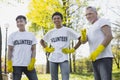 Cheerful three volunteers planning cleaning