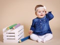 Cheerful toddler with big pencils Royalty Free Stock Photo