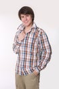 Cheerful toothy young man in checked shirt and smart casual wear Royalty Free Stock Photo