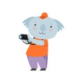 Cheerful tourist koala bear taking pictures with camera, cute animal cartoon character travelling on summer vacation