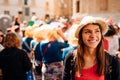 Cheerful tourist visiting to the public celebration,attending carnival.Carnival season.Crowd in costumes traditionally parading