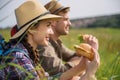 Cheerful tourists having rest on field Royalty Free Stock Photo