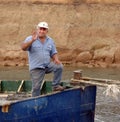 A cheerful towboat man on the Corinth Canal