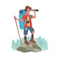 Cheerful traveler man with a big backpack stands on the mountain