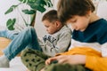 Cheerful two Childs boys playing online game, watching video on cellphone. Smiling kids using funny mobile apps Royalty Free Stock Photo