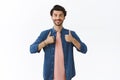 Cheerful, upbeat good-looking bearded caucasian man in shirt, t-shirt showing thumbs-up and smiling, give approval