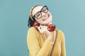Cheerful vintage style woman on the phone Royalty Free Stock Photo