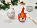 Cheerful wadding toy cats by handmade. Funny red and white cats