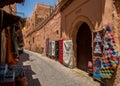 Carpets for sale hanging on the street. Typical alley wall at the Medina of Marrakesh. Royalty Free Stock Photo